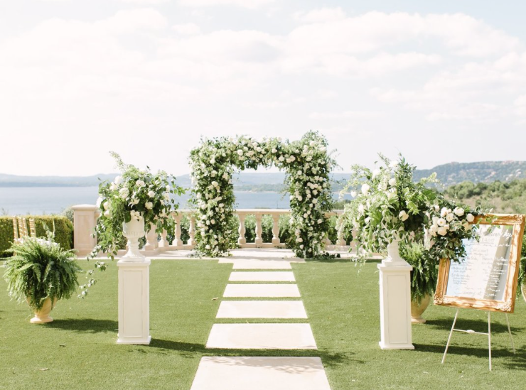 luxury floral arch with pedestal flowers destination wedding