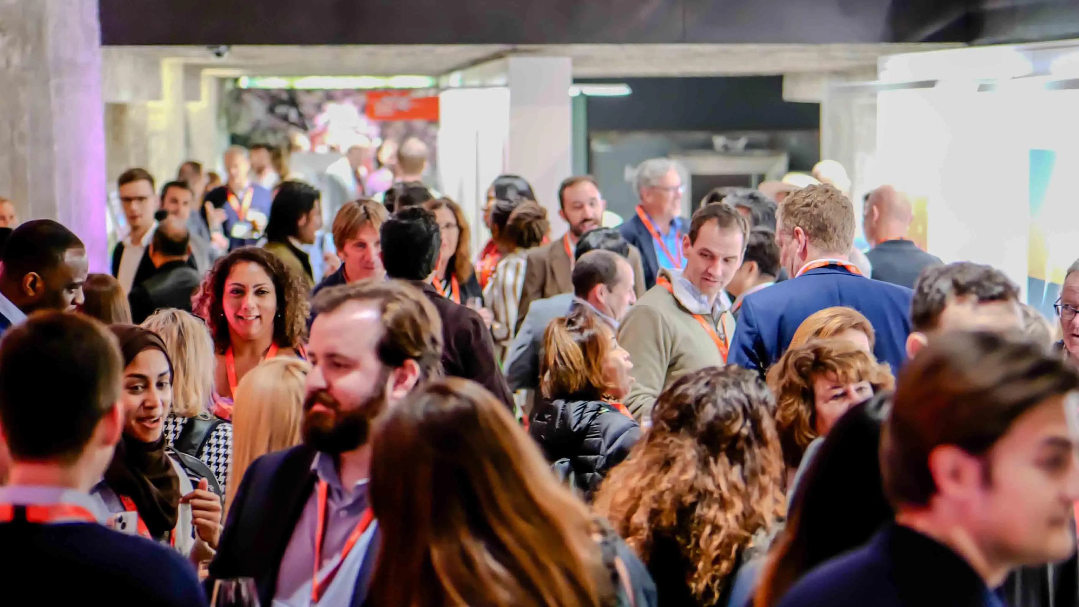 Large crowd of attendees networking during the Virgin Atlantic and British Consulate 30-year celebration event at the Center for Architecture + Design in San Francisco.