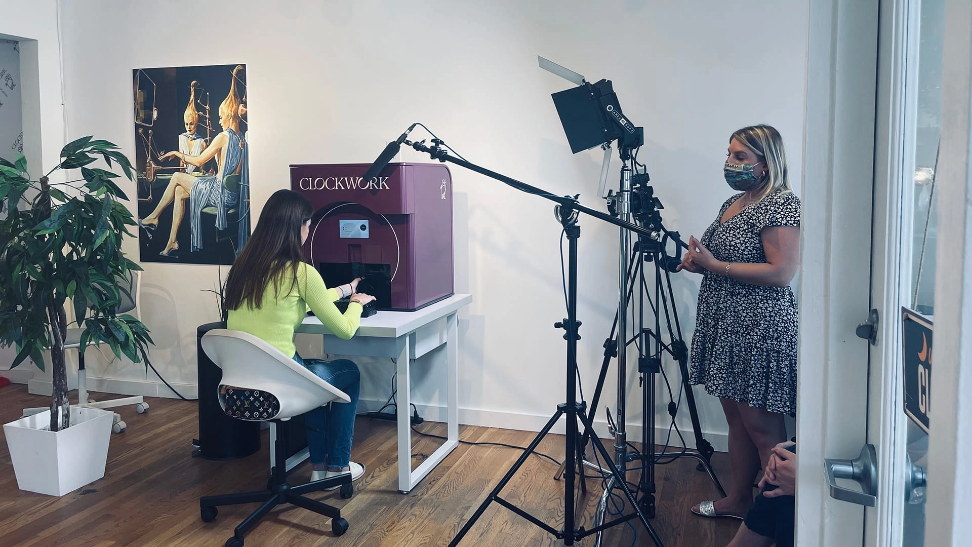Bidar Video filming a step-by-step Clockwork robot nail polish tutorial with lighting, camera, and crew in a showroom setting.