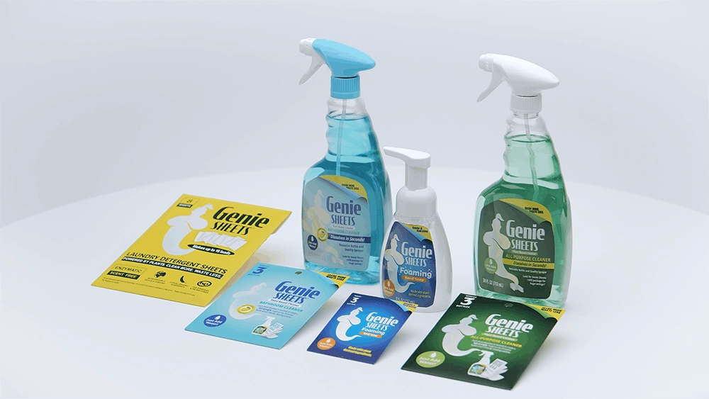 Studio product lineup of Genie’s Sheets cleaning products, including spray cleaners, foaming hand soap, laundry detergent sheets, and dissolvable cleaning sheet packs on a white background.