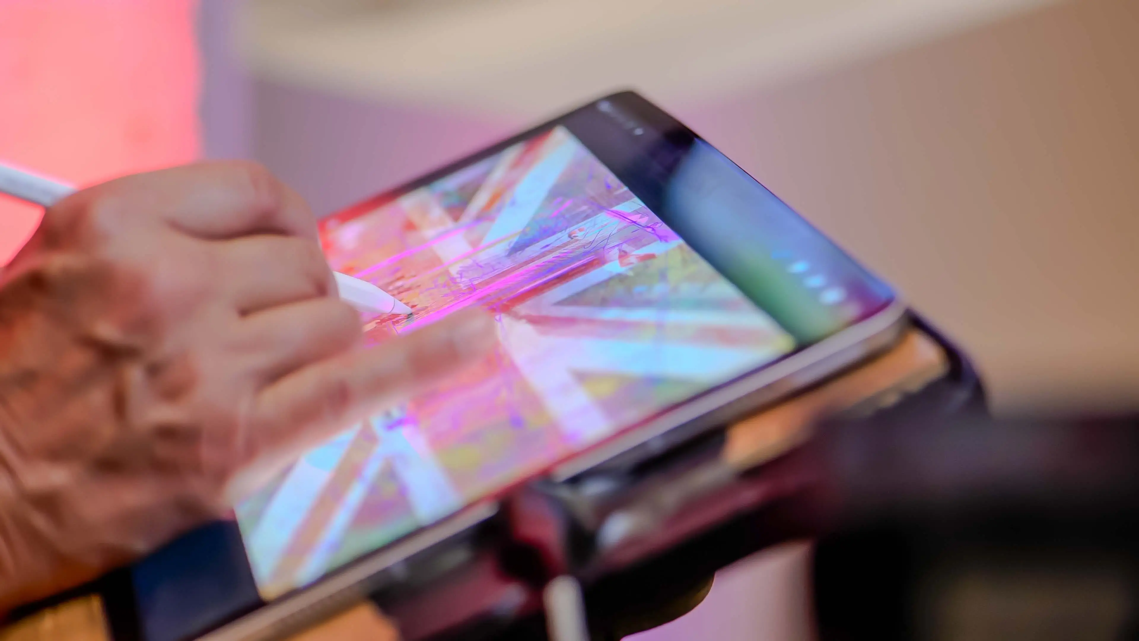 Close-up of a digital tablet displaying a stylized Union Jack as an attendee draws with a stylus during the Virgin Atlantic and British Consulate event in San Francisco.