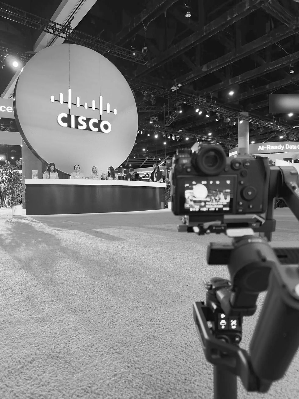 Behind-the-scenes view of a documentary interview filming setup with professional lighting and camera equipment