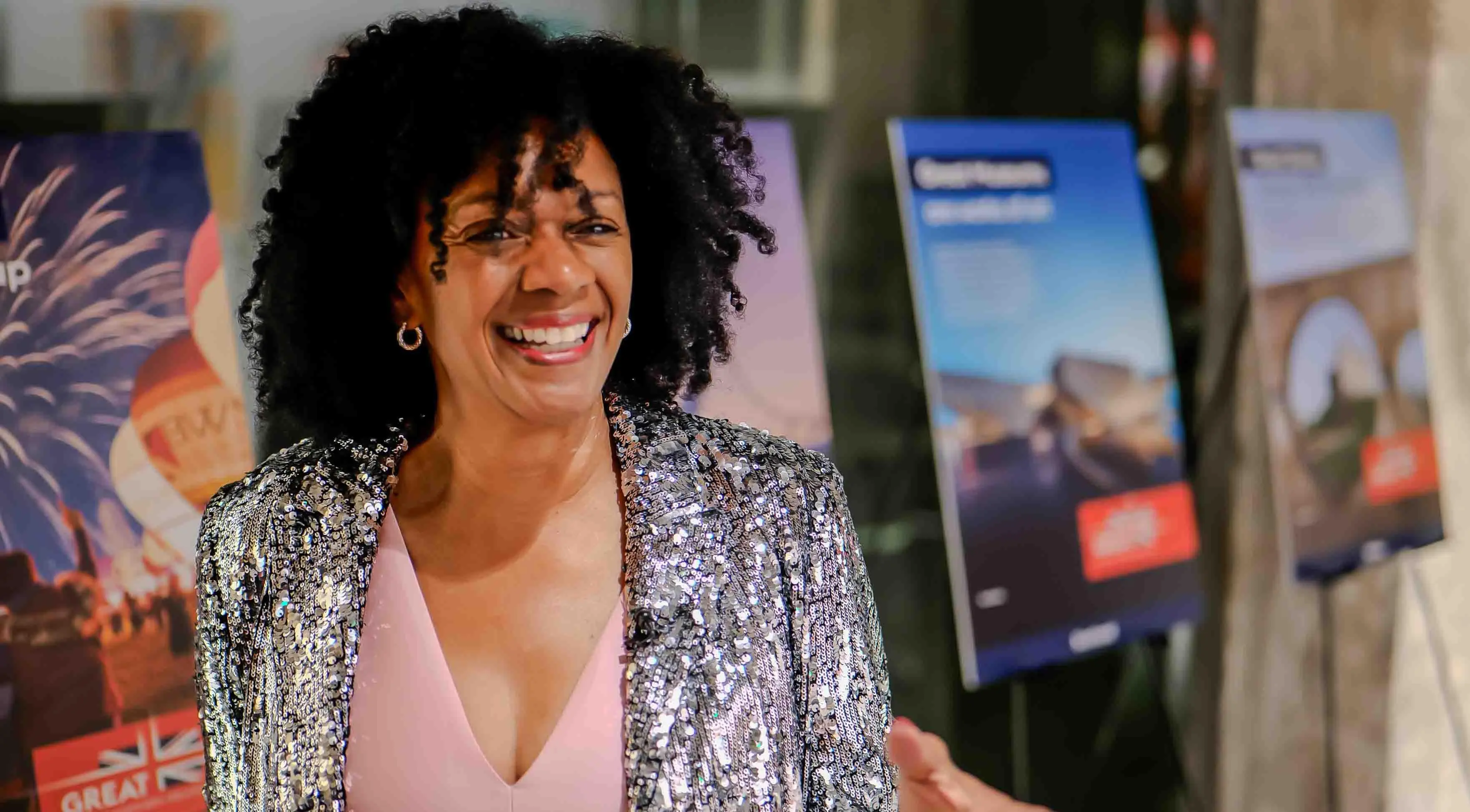 Elizabeth Shaw, founder of 1000 Black Voices, smiling during the Virgin Atlantic and British Consulate celebration event at the Center for Architecture + Design in San Francisco.
