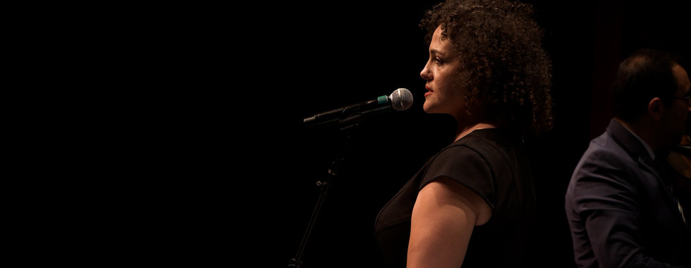 A profile/side shot of a singer