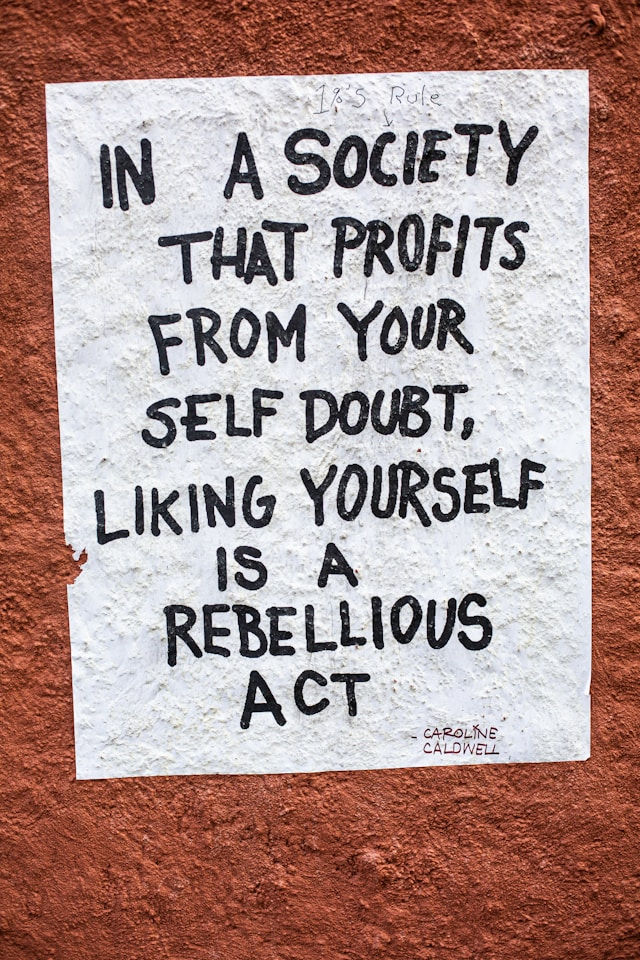 In a society that profits from your self-doubt, liking yourself is a rebellious act.