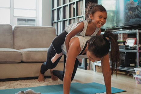Image credit: Pexels
Source: https://www.pexels.com/photo/young-asian-woman-piggybacking-smiling-daughter-while-exercising-at-home-5094677/