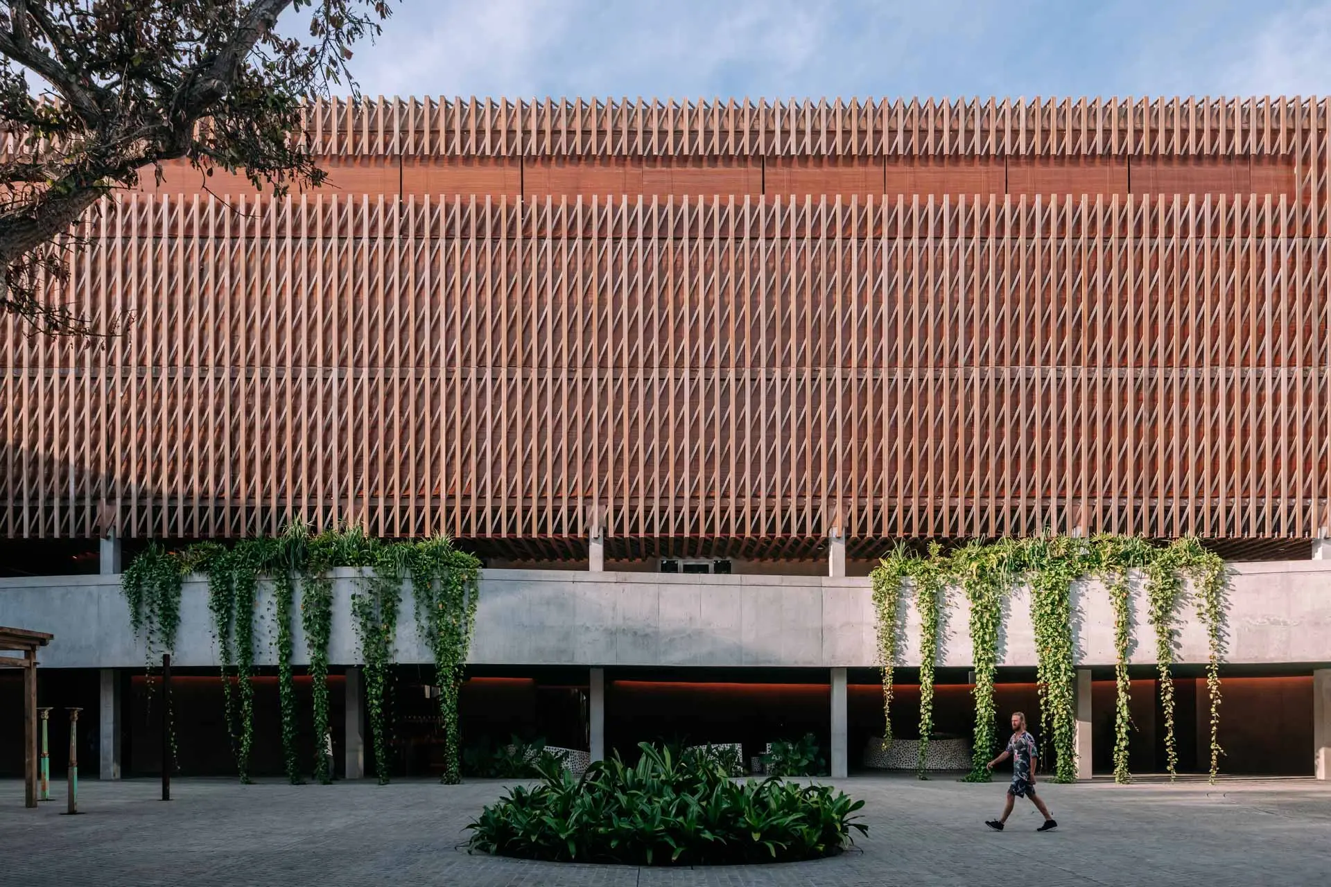 Open and playful terracotta-toned brick walls