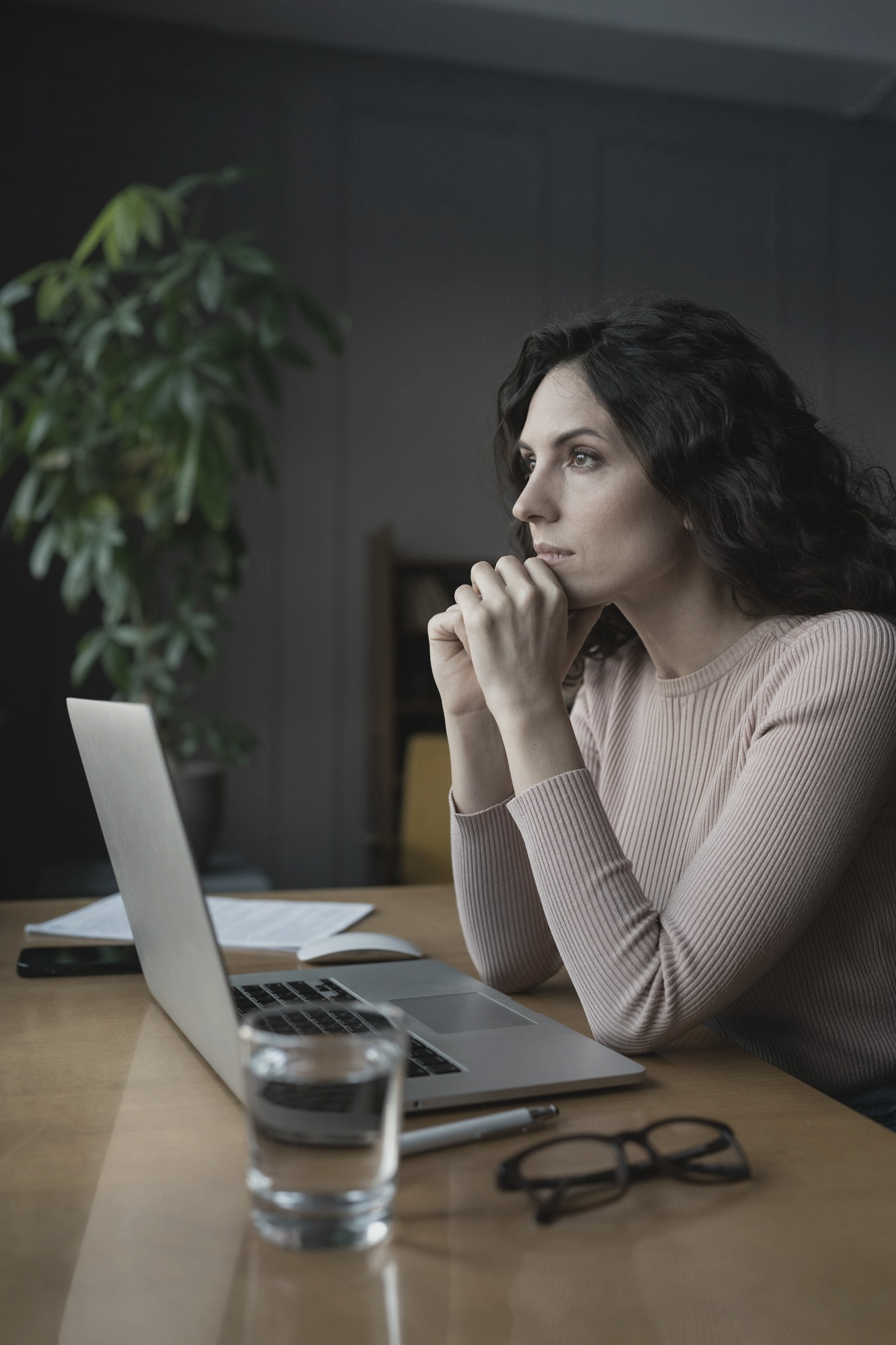 Image - Distracted thoughtful woman sit with laptop thinking, procrastinating suffer from lack of motivation