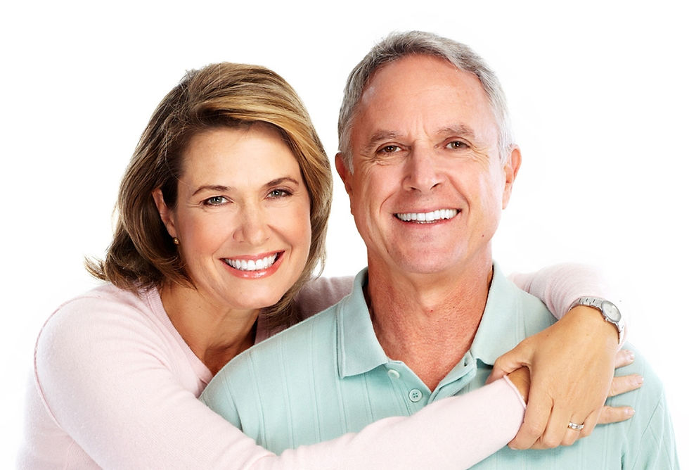 Happy senior couple smiling confidently after receiving dental implants at Henley Dental in Homebush West.