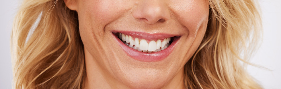closeup-smile-and-woman-mouth-in-studio-for-denta-2023-11-27-05-08-25-utc.jpg