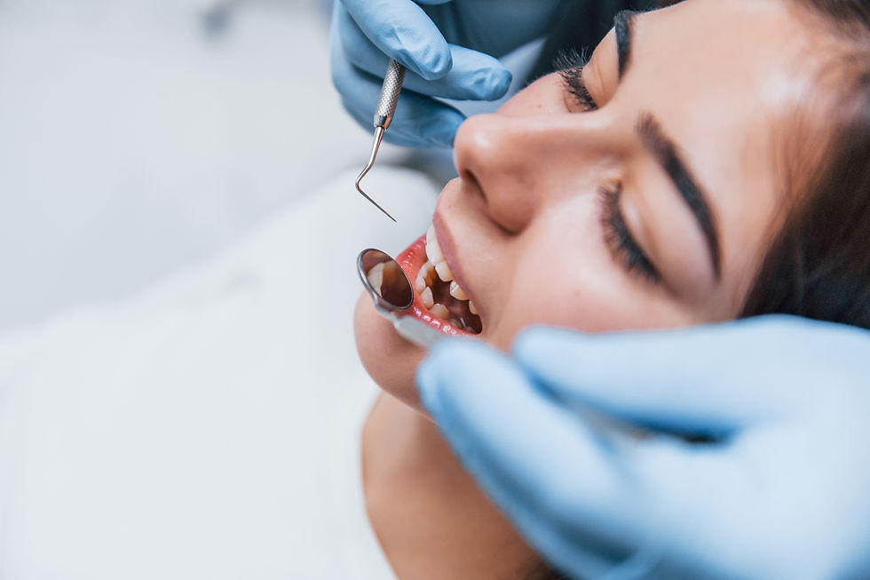 Dentist performing a thorough examination of a patient's mouth to assess wisdom teeth condition in Homebush West