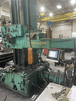 Industrial machine in a factory with "Giddings & Lewis" label. Rossi Machinery Services logo and detailed contact info above in text.