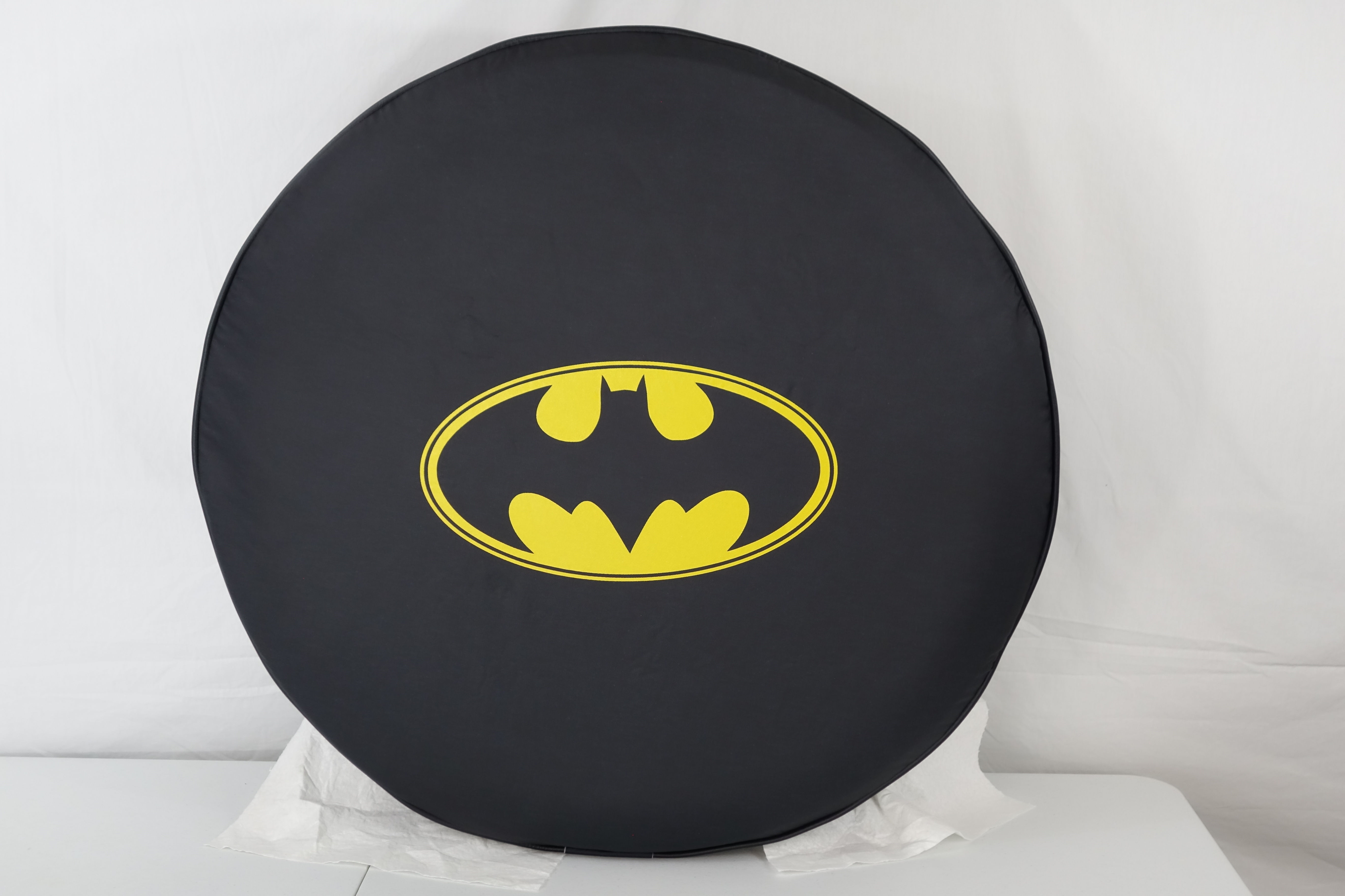 Classic Batman logo spare tire cover in matte black denim vinyl