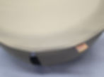 Close up of the authentic brand tag on a khaki marine grade vinyl spare tire cover