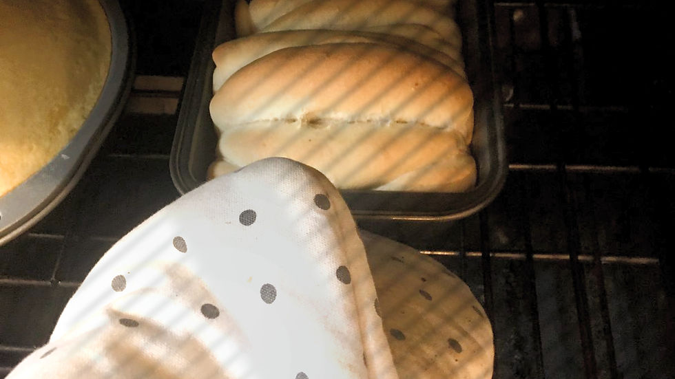 Eye-level view of a spoon gently scooping flour into a measuring cup