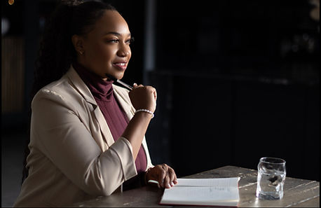 Professional woman listening intently at a table