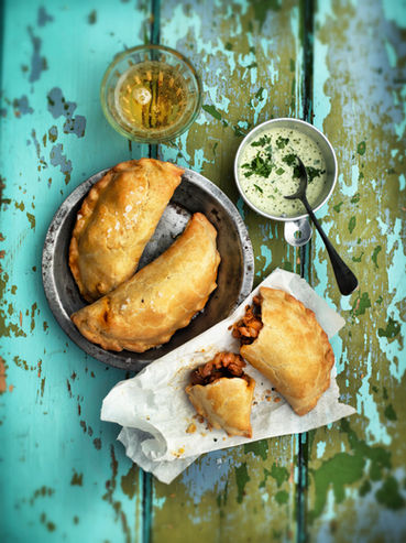 Chicken empanadas on blue background from Jennifer Joyce My Street Food Kitchen book.
