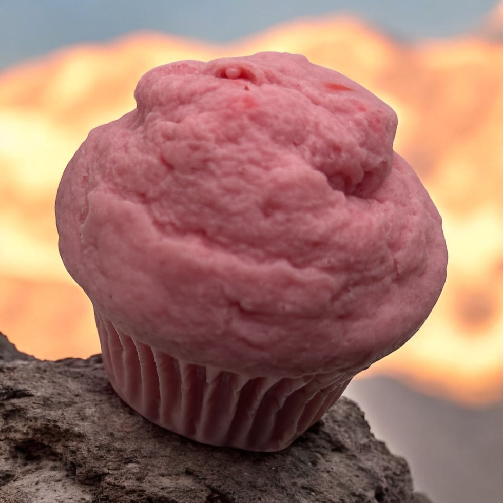 Thumbnail: Pink cupcake candle on rock