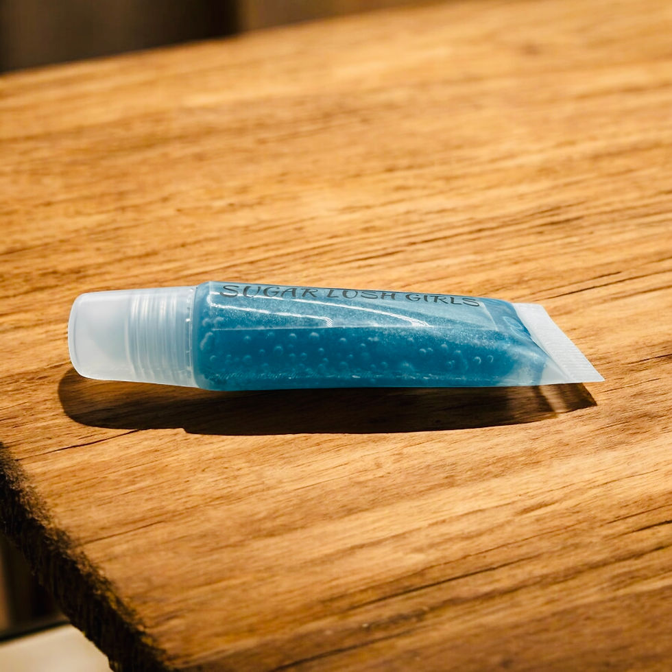 Thumbnail: Squeeze tube of teal lip gloss
