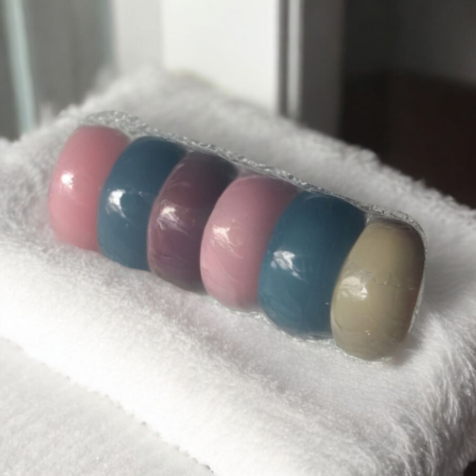 Thumbnail: Five colorful bath bombs on a towel