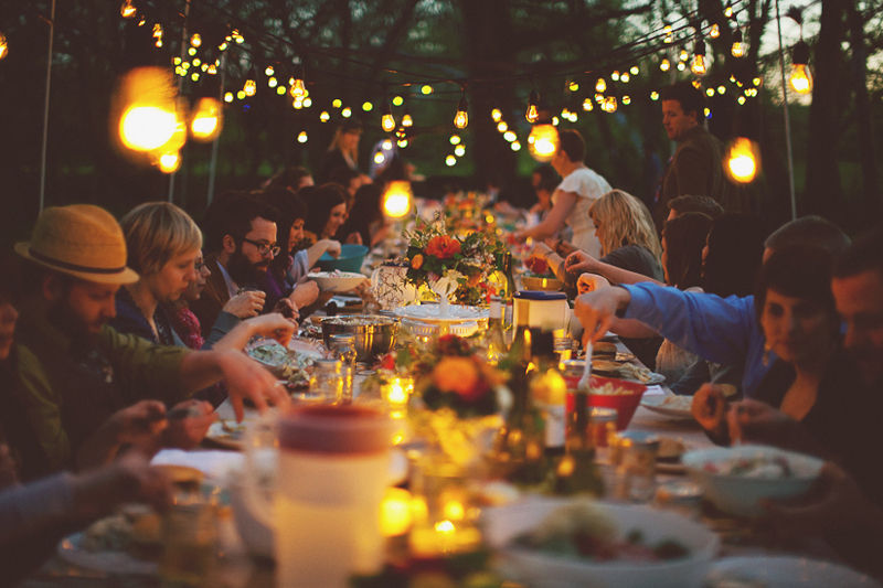 Outdoor dinner party of many people