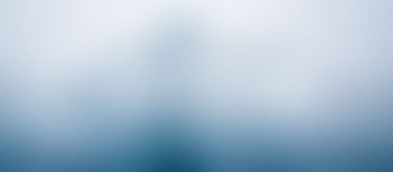 An iceberg floating in calm, blue water under an overcast sky, symbolizing the depth and hidden potential of Emerging Tech Trends beneath the surface. The scene is serene, with muted blues and whites suggesting untapped innovation.