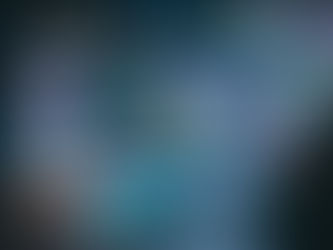 AI Automation dashboard: hands use a stylus on a tablet with holographic data analytics and AI interfaces, surrounded by vibrant charts and graphs.