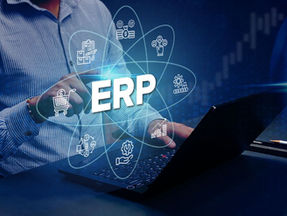 Man in striped shirt using laptop, finger touching virtual icons around “ERP” text. Blue background with digital financial graphics, symbolizing analysis of Why ERP Projects Fail and strategies for improvement.