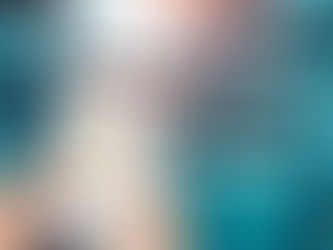 Reducing ERP Customization: hands holding a tablet displaying graphs and charts in a modern, brightly lit warehouse with shelves and boxes in the background.