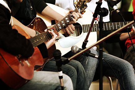 People playing guitars.