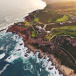 A visually stunning course in South Africa perched on dramatic cliffs overlooking the ocean, known for its challenging layout and breathtaking views.