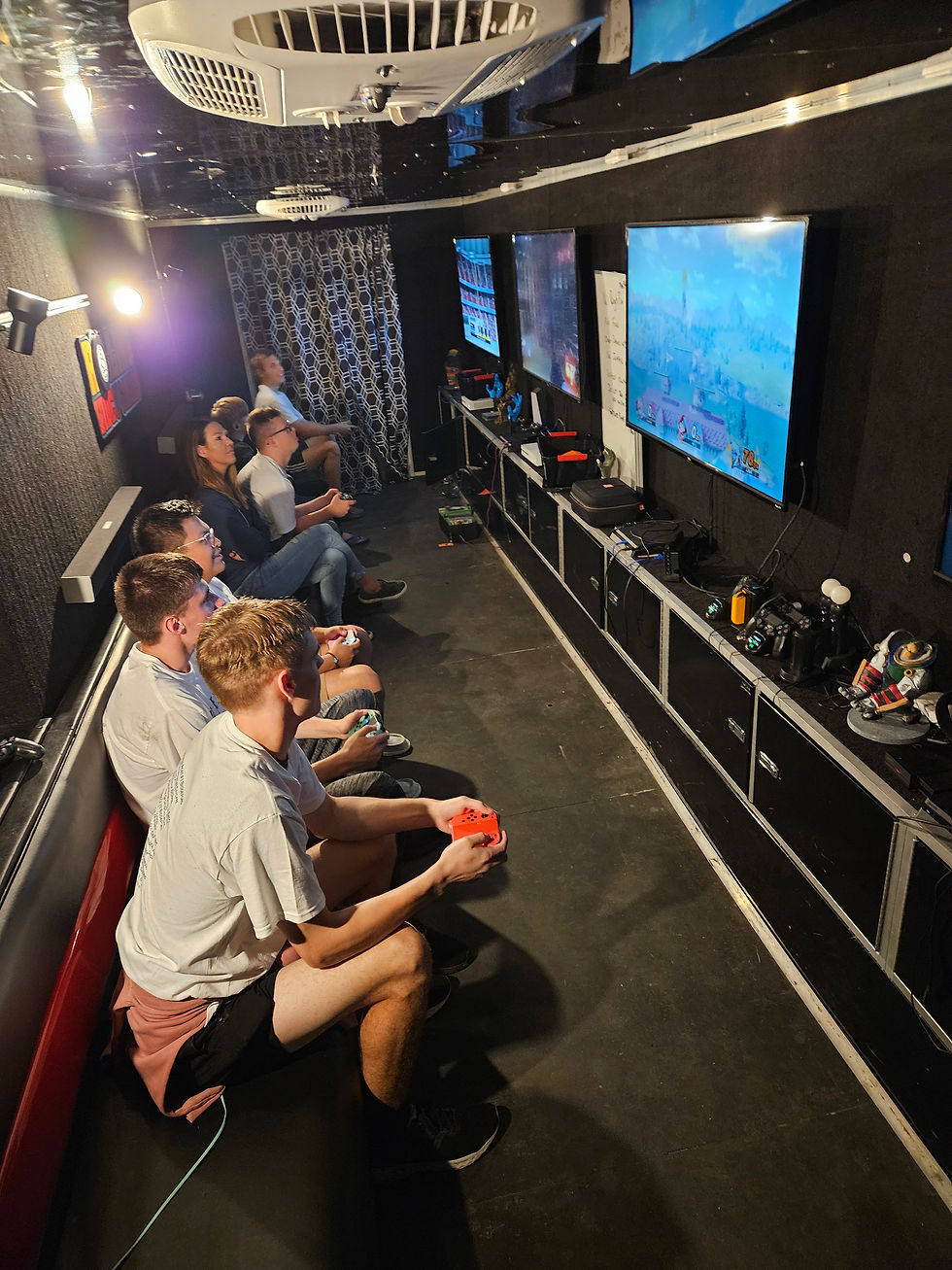 Image inside the game trailer with graduates of Biddeford High Class of '24 celebrating Project Sunrise