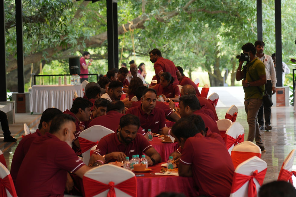 Corporate team sharing a meal at Hanu's Table at Hanu Reddy Raghava Farms after a day of outdoor team building activities