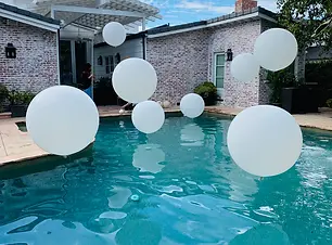 white-swimming-pool-floating-balloons.webp