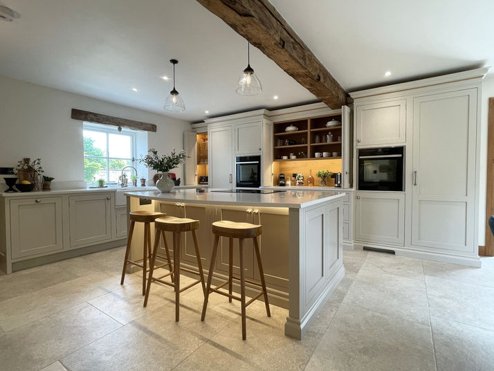 Handmade Inframe kitchen painted in Farrow and Ball Skimming Stone. Island painted in Charlestone Grey. 