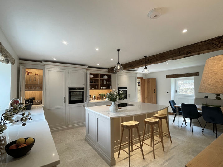 Handmade Inframe kitchen painted in Farrow and Ball Skimming Stone. Island painted in Charlestone Grey. 