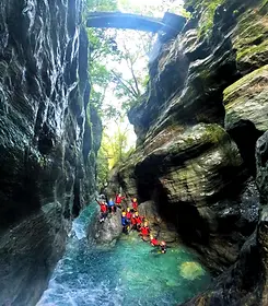 Nakatsu canyoning gorge Japan Shikoku outdoor activity red lifejackets green cliffs