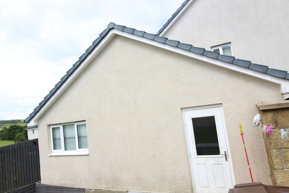 Clean exterior of a house after a soft wash service.
