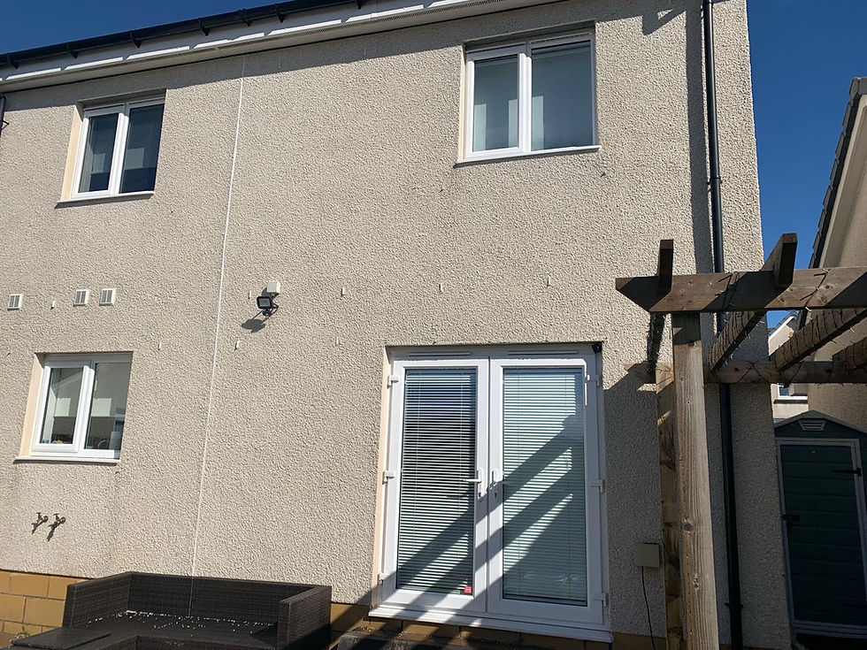 Clean exterior of a house after a soft wash service.