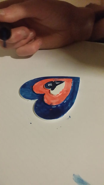 young person painting fridge magnets
