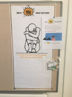 Bulletin board with a mental health poster showing a sad figure. Text reads "Youth Mental Health Week, 19th September 2025."