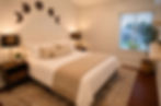 Third bedroom with queen bed, mirrored closet, and premium linens in a furnished West Hills home.