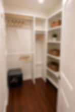 Spacious walk-in closet with built-in shelving, in-room safe, and ample storage in a furnished West Hills home.