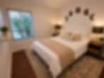 Guest bedroom with queen bed, mirrored closet, and premium linens in a furnished West Hills home.