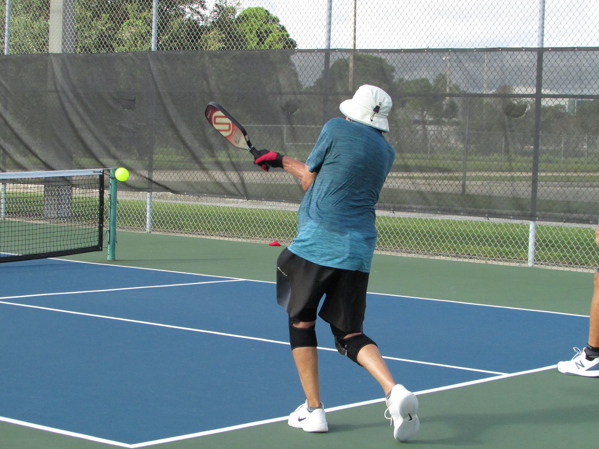 Players practicing physical distancing