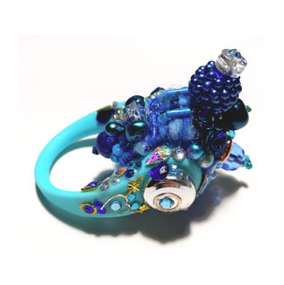 Wool, cotton, glass, agate, acrylic metal and plastic on  silicone cock ring. 