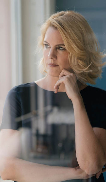 serious-blond-woman-looking-out-of-window-2022-11-06-23-10-43-utc (1).jpg