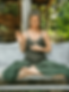 A woman meditates and does yoga in nature