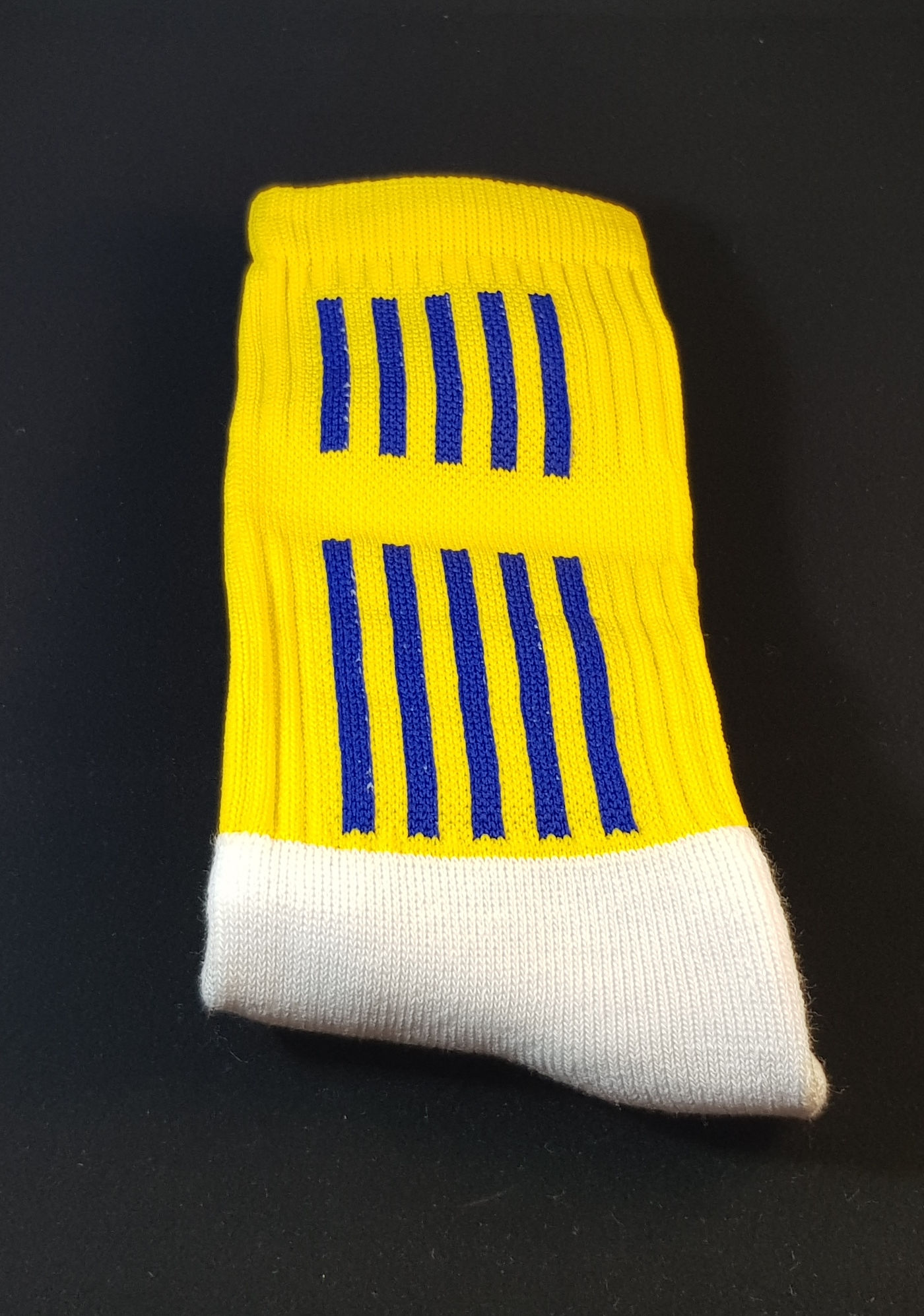 Gold sock with blue stripes
