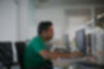 A man is using a computer